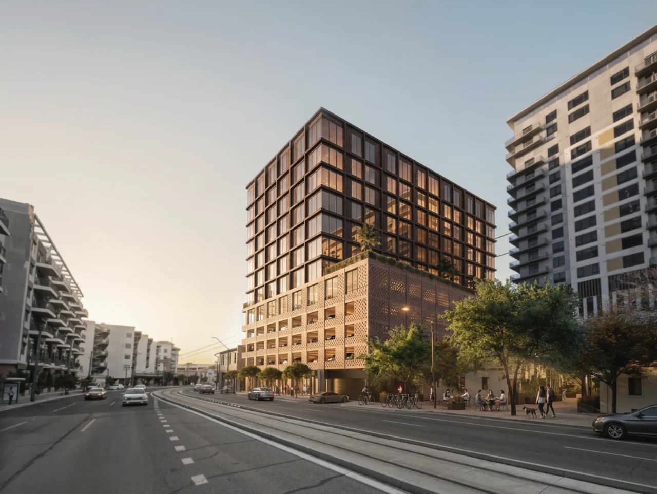 SISU's bronze residential tower above its textured masonry podium in downtown Phoenix